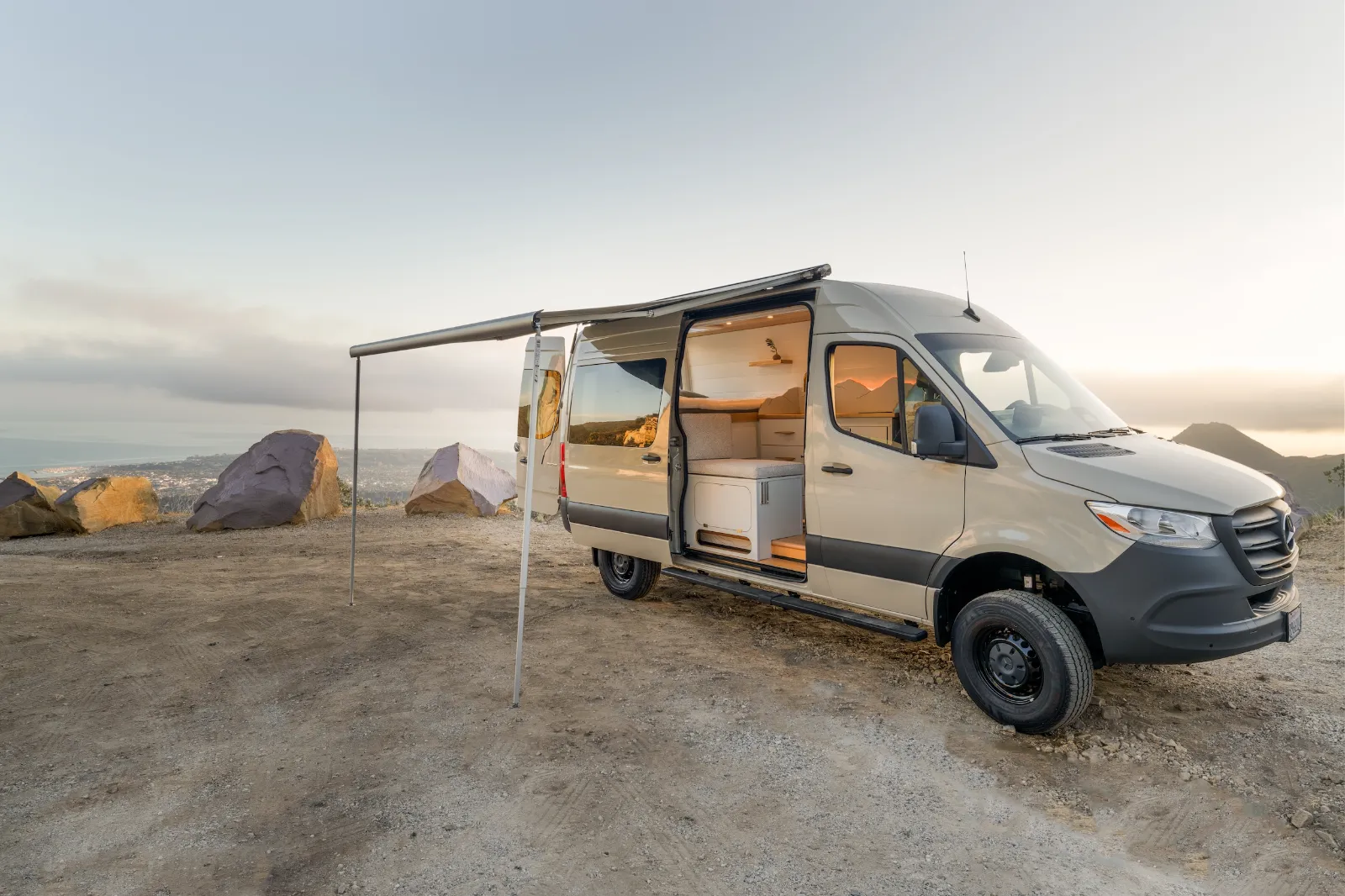 Van with the awning out at sunset
