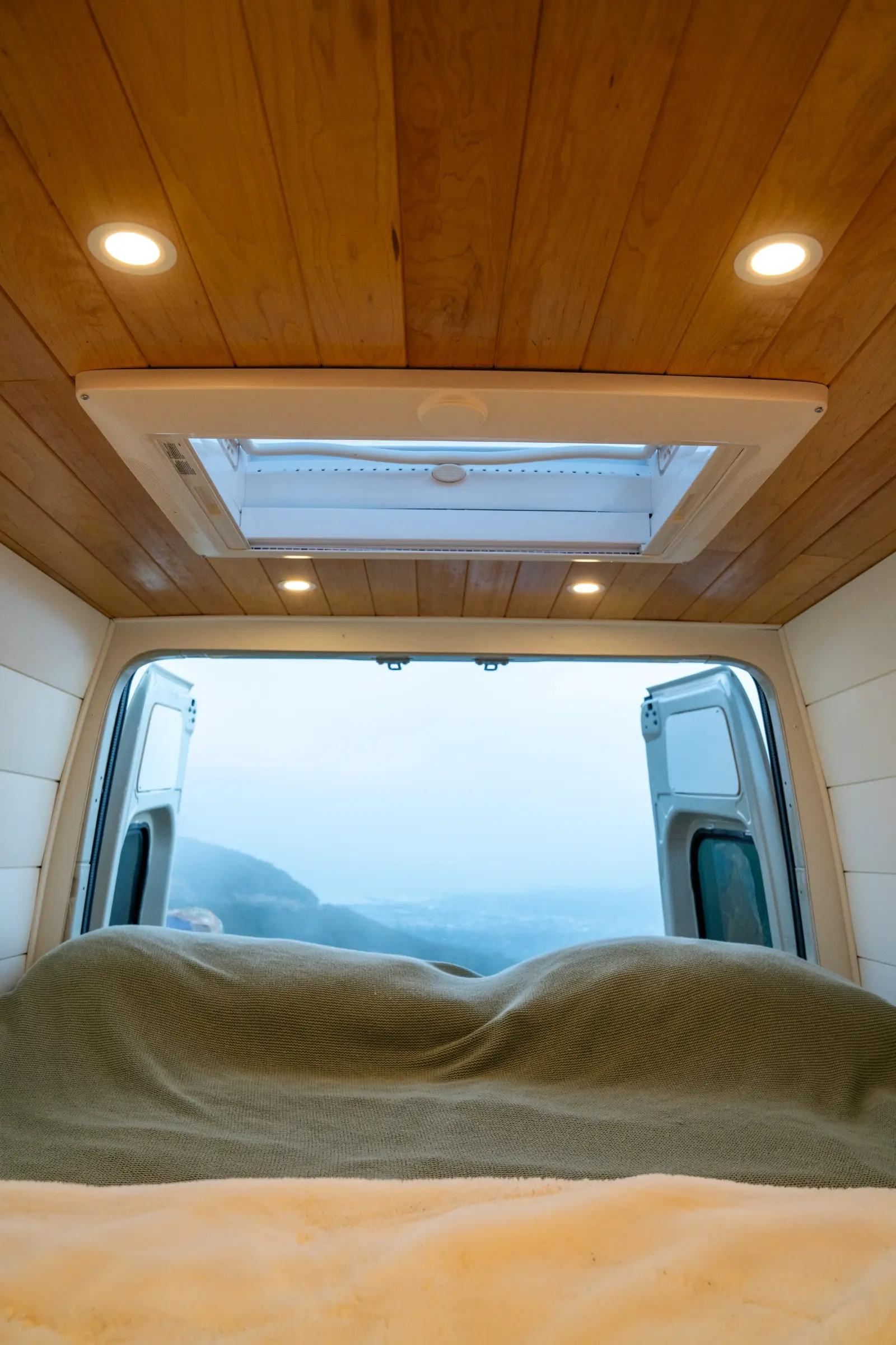 Skylight over the bed with the doors open